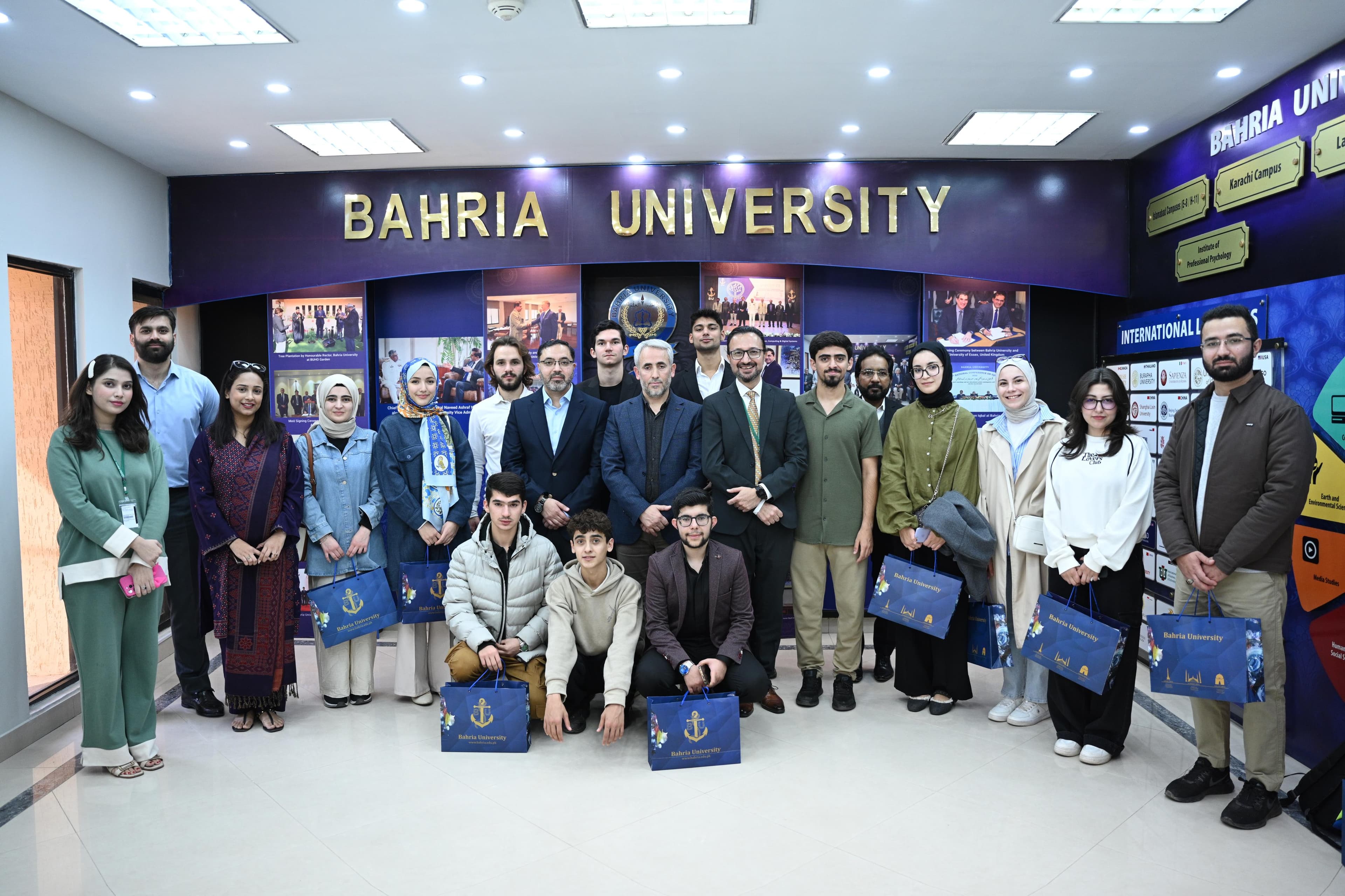 University students reviewing applications together on campus